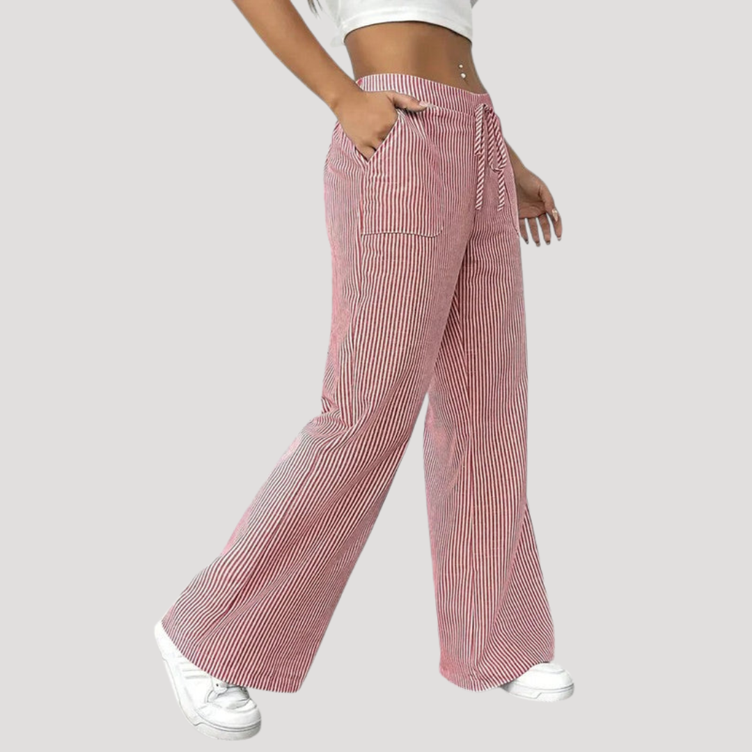 Pantalon femme à jambes larges rayées, offrant confort et fluidité. Style décontracté et chic pour une silhouette élégante.