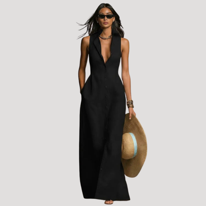 Magnifique robe longue boutonnée femme, coupe cintrée sans manches, pour une tenue estivale élégante et chic.