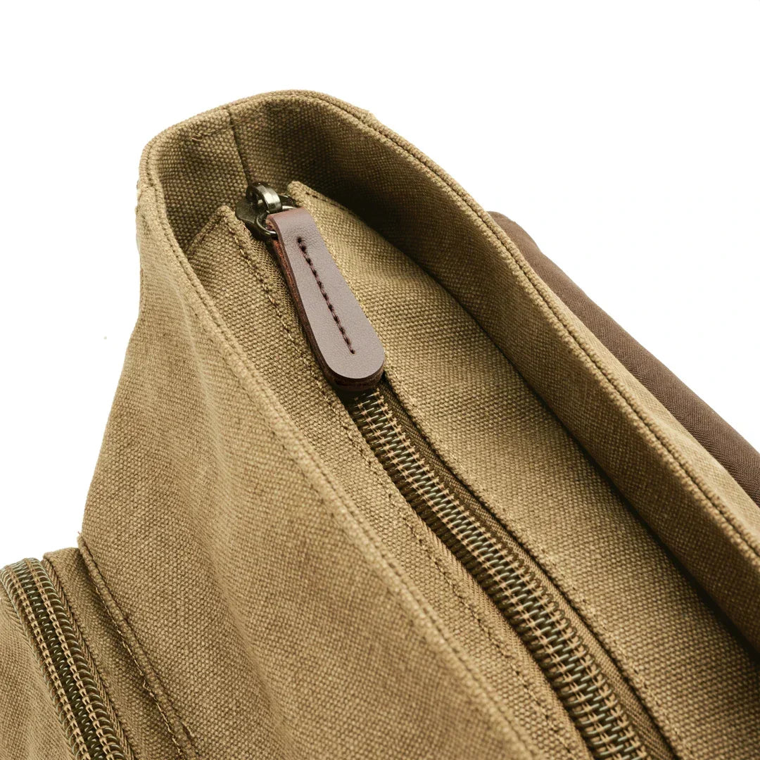 Sac de voyage à bandoulière robuste en toile, parfait pour transporter vos essentiels en sécurité.