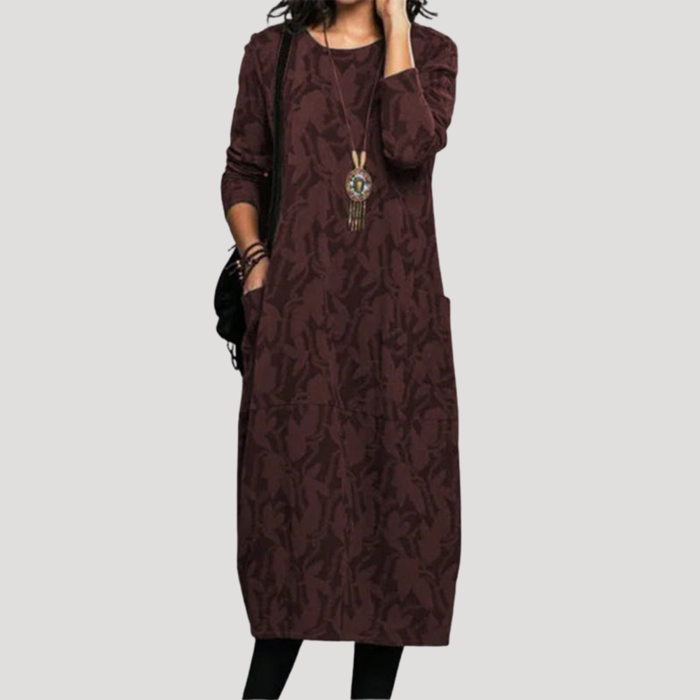 Élégante robe midi femme à motifs fluides, tissu léger et confortable. Parfaite pour un look casual ou quotidien.