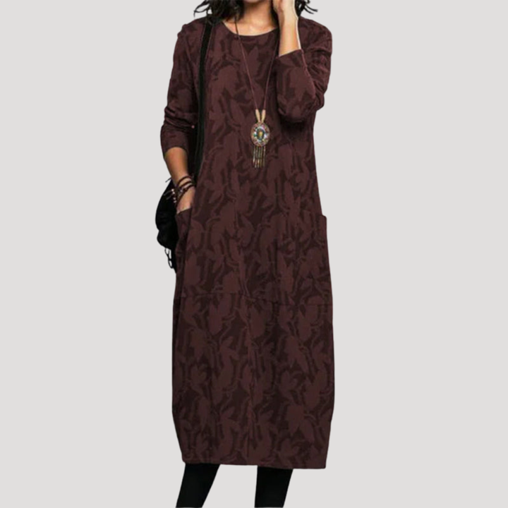 Élégante robe midi femme à motifs fluides, tissu léger et confortable. Parfaite pour un look casual ou quotidien.