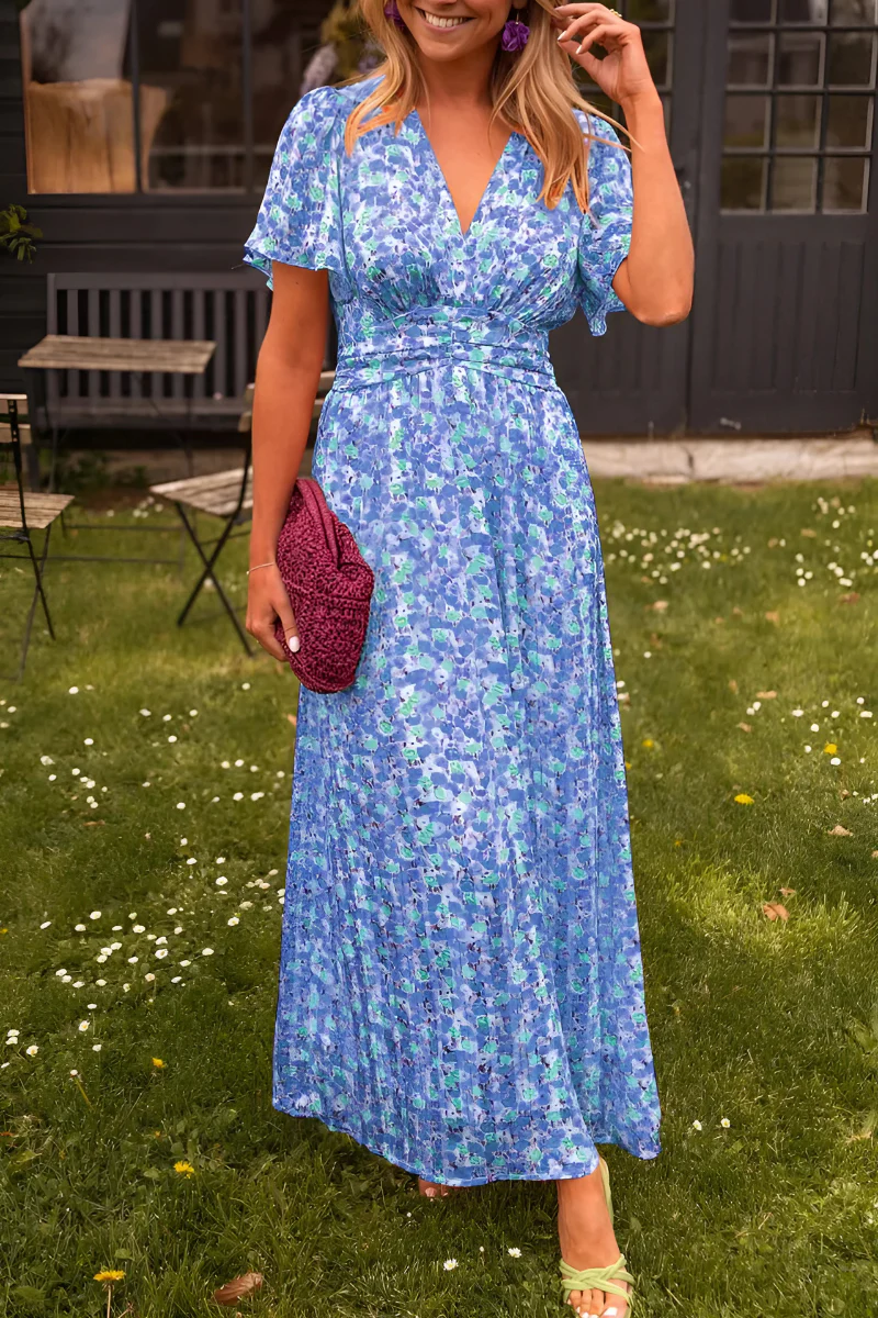 Robe fleurie sans manches Elisa, coupe fluide pour femme. Idéale pour les journées chaudes du printemps et de l'été.