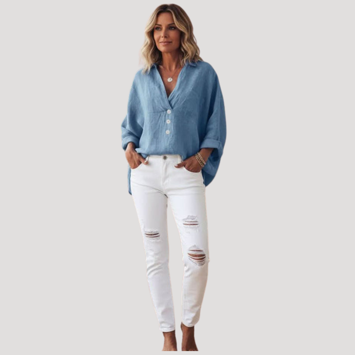 Chemisier ample femme, coupe fluide, détails boutons, parfait pour un look décontracté chic.