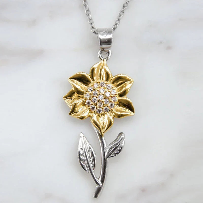 Bijoux femme : collier tournesol doré brillant, symbole de joie et élégance. Un cadeau parfait.