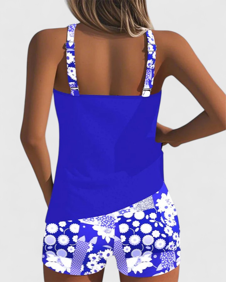 Maillot de bain tankini femme: Dos nageur, top uni et short floral pour un look estival confort.