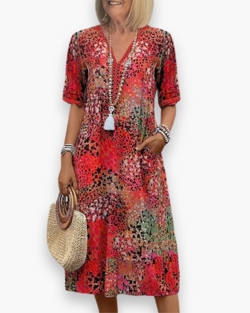 Robe midi imprimée femme, style fluide et élégant, idéale printemps-été ou soirée décontractée.