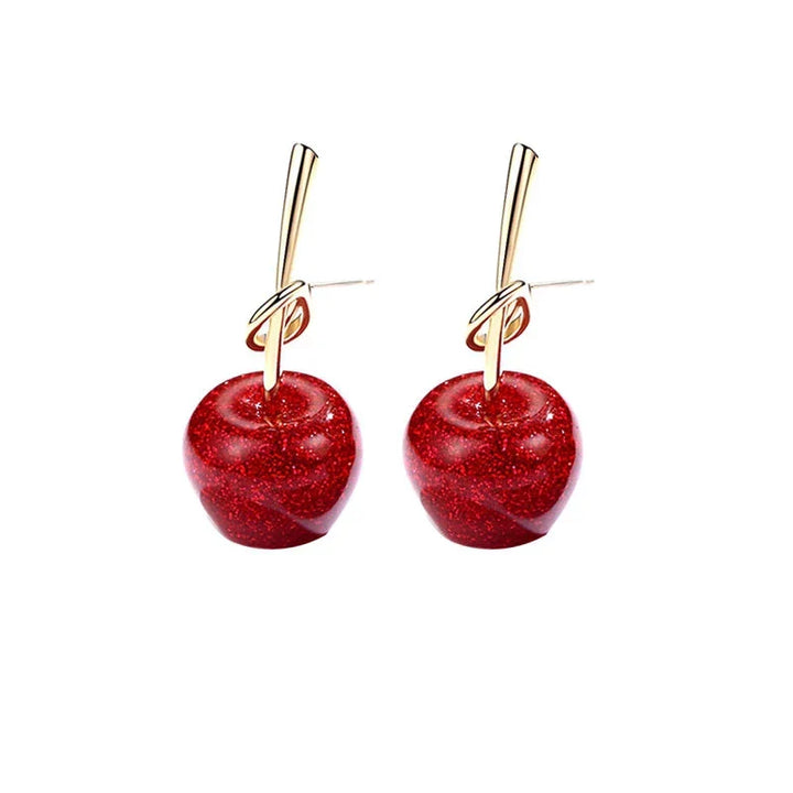 Boucles d'oreilles cerises rouges vibrantes, accessoire tendance pour femme, apporte gaieté.