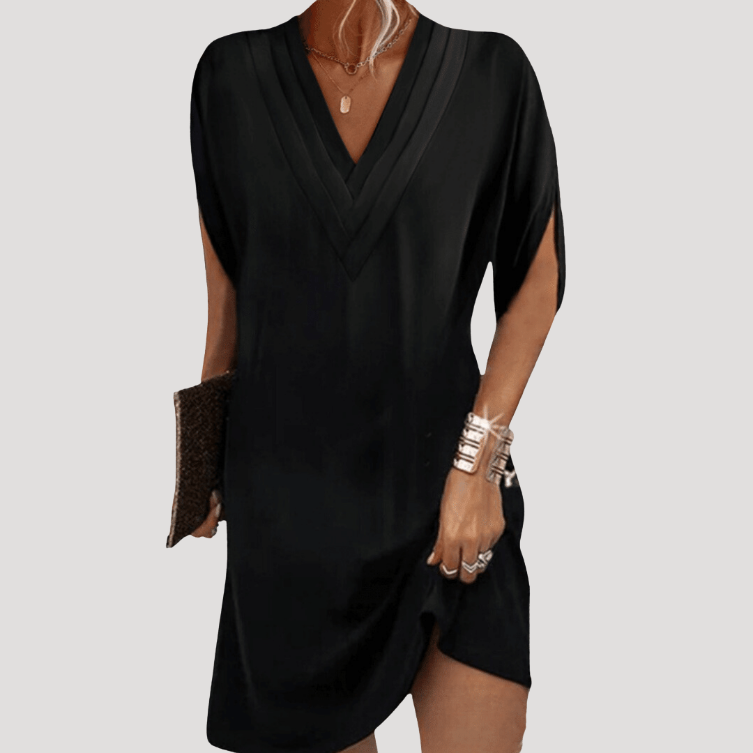 Robe femme fluide et élégante, coupe courte à col V, parfaite pour un look décontracté ou habillé.