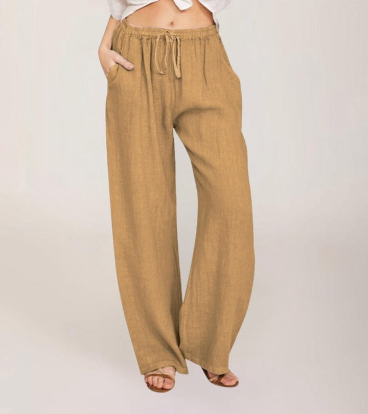Vêtement femme polyvalent: Pantalon large taille haute en lin, style décontracté estival.