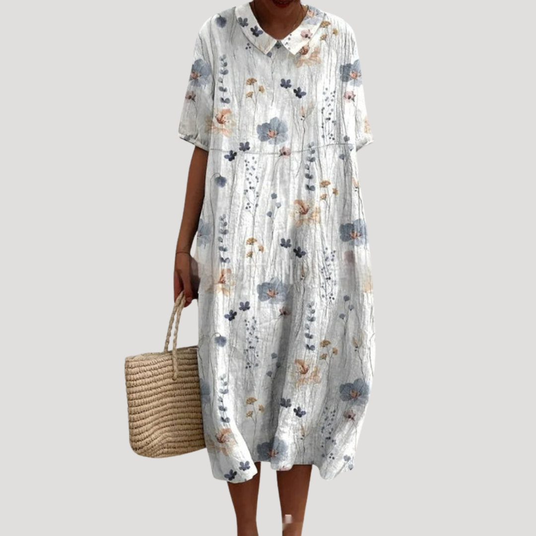 Robe femme imprimée mi-longue, coupe ample et décontractée. Idéale pour un look élégant et polyvalent.