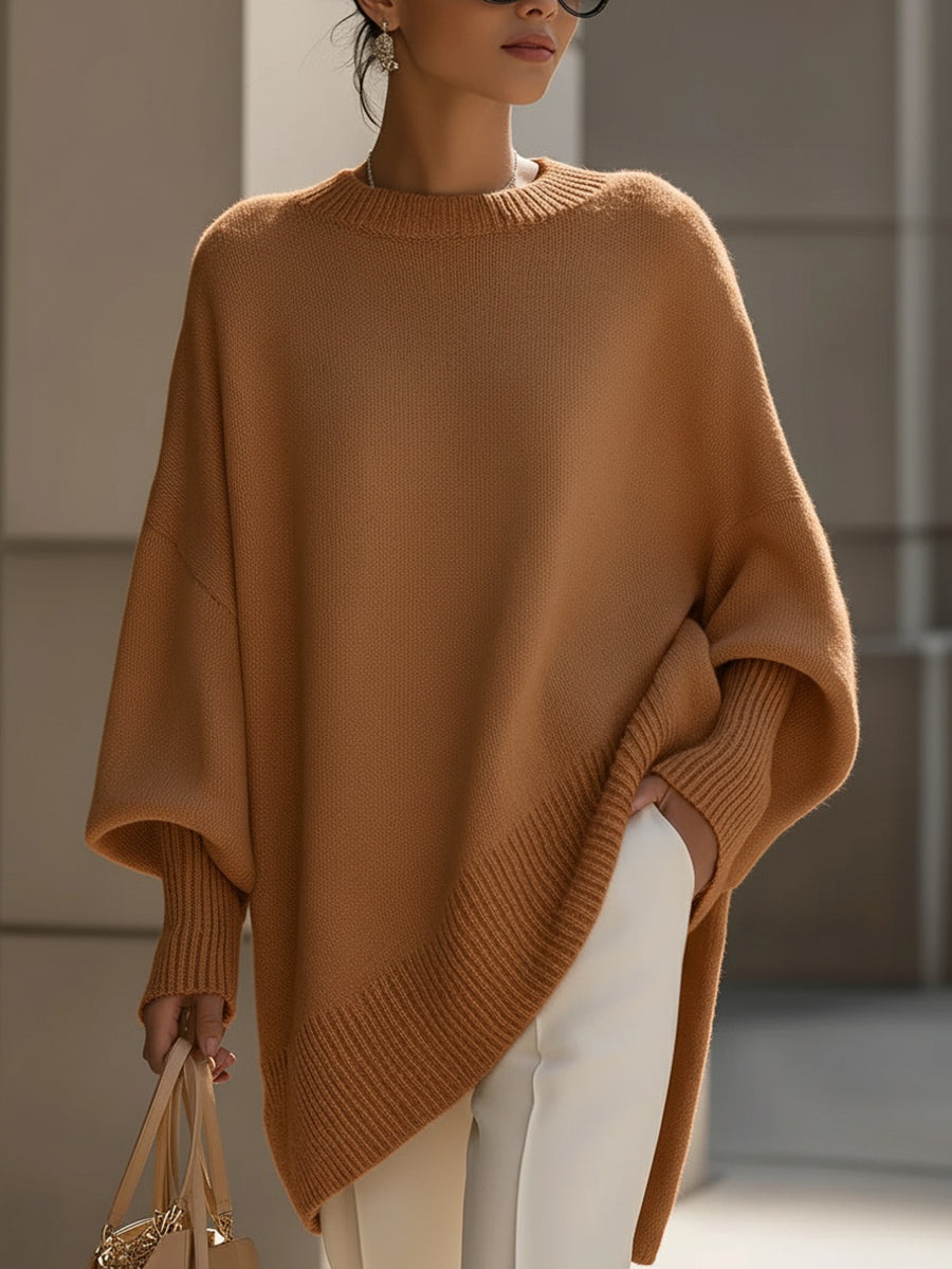 Élégant poncho oversize femme en maille fine, parfait pour une couche chic et un confort optimal.
