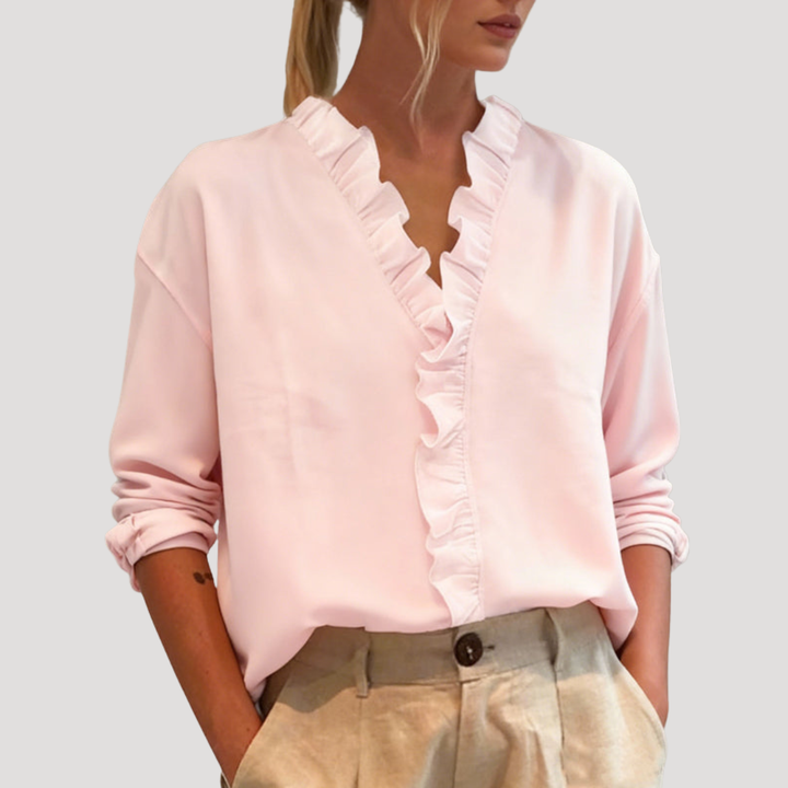 Chemisier femme chic à manches longues, volants délicats. Idéal pour un style élégant et fluide au printemps ou en automne.