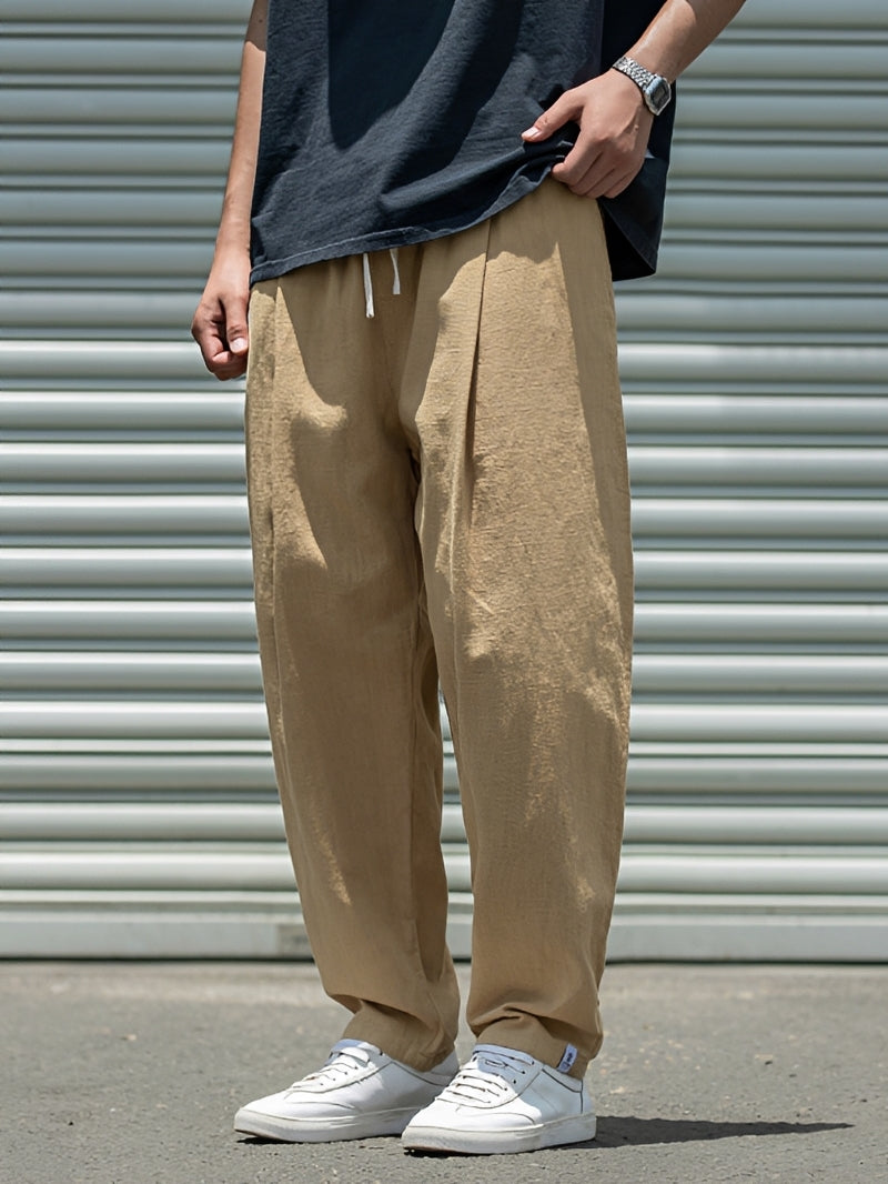 Pantalon homme décontracté coupe droite ample. Style casual polyvalent pour l'été, le quotidien et les loisirs.