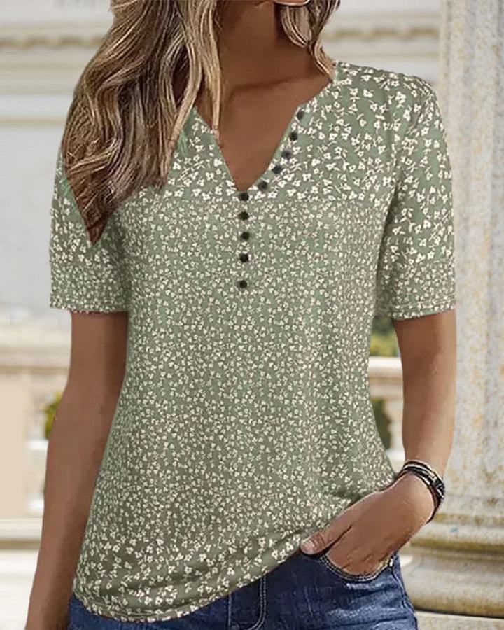 T-shirt femme élégant avec motif floral, parfait pour l'été. Vêtement décontracté chic à manches courtes et tissu stretch.