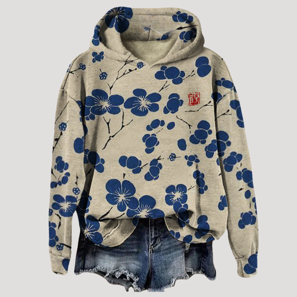 Sweat femme élégant à capuche avec motif floral délicat, idéal pour un look printanier ou casual.