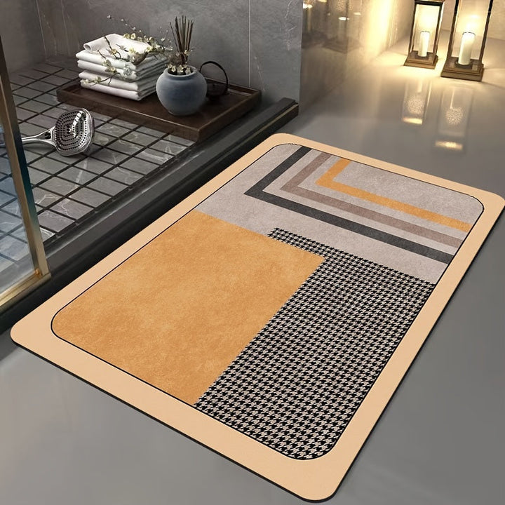 Motif géométrique distinctif: tapis de bain luxe, ultra-absorbant et antidérapant, pour une hygiène optimale.