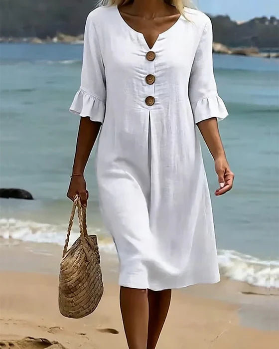 Robe d'été femme fluide en coton lin, boutonnée, avec manches volantées. Idéale pour vacances plage.