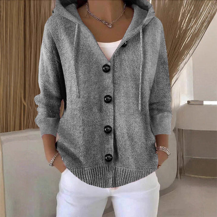 Cardigan ample femme à capuche avec boutons, chaud et doux. Style décontracté et confort quotidien garanti.