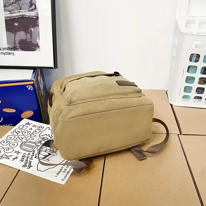 Sac à dos homme en canvas marron, pratique et élégant pour le travail ou les loisirs.