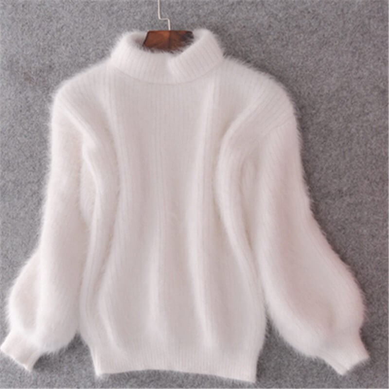 Doux pull femme ample, chic et décontracté, parfait pour l'automne-hiver. Confort moderne garanti.