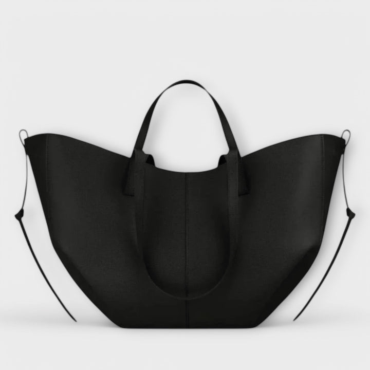 Accessoire de mode chic: sac à main spacieux en simili cuir avec bandoulière amovible.