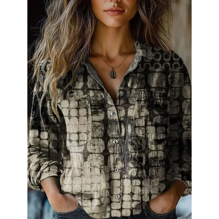 Haut femme chic à manches longues et motif 3D distinctif. Ce chemisier ample combine confort et élégance.