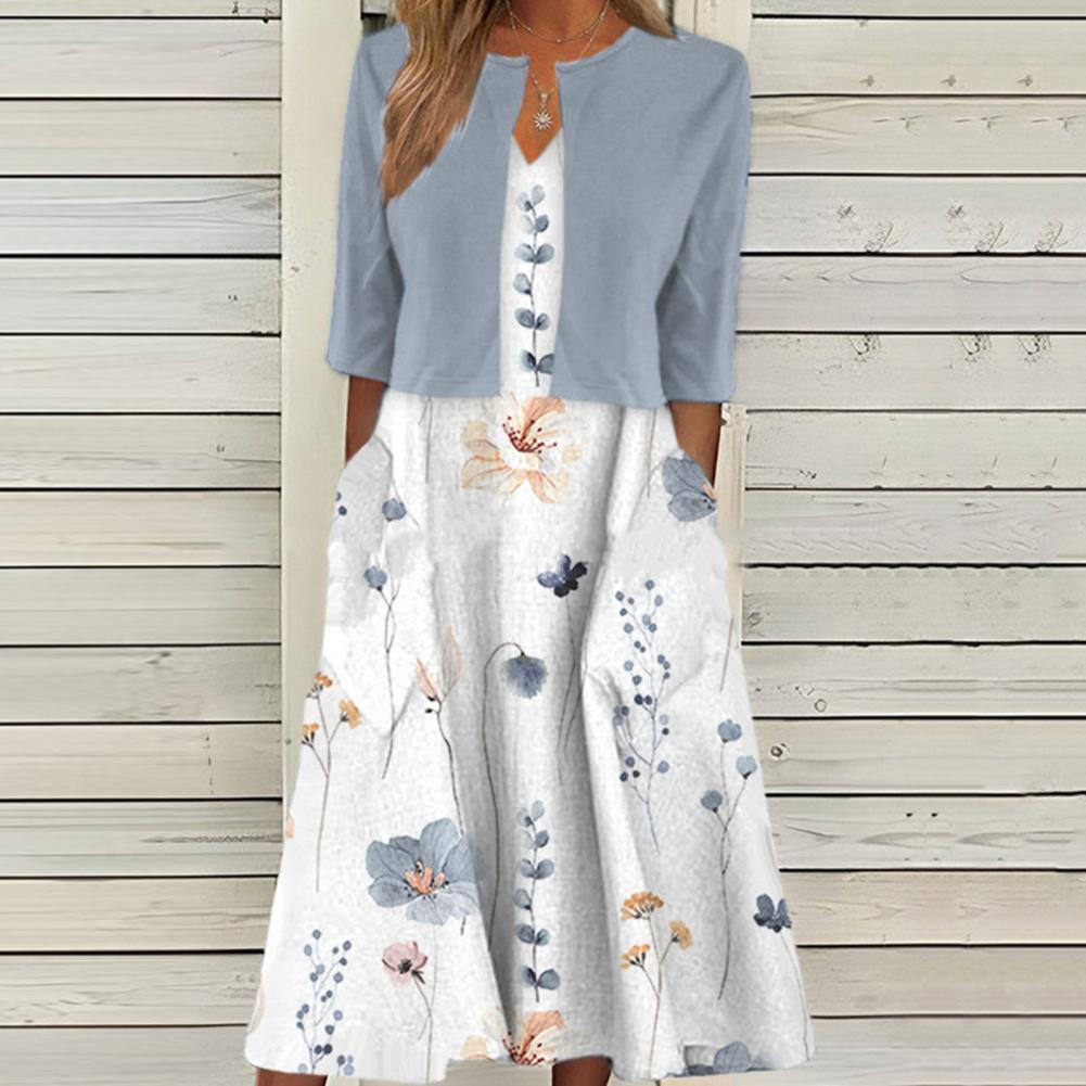 Robe midi fleurie élégante pour femme, idéale été/printemps, motif floral délicat, tissu fluide confortable.