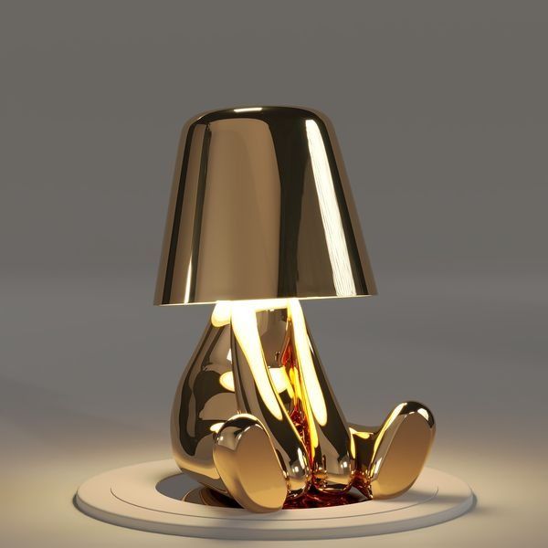 Objet de décoration lumineuse, lampe de table Le Penseur dorée, sans fil, avec LED intégrée.