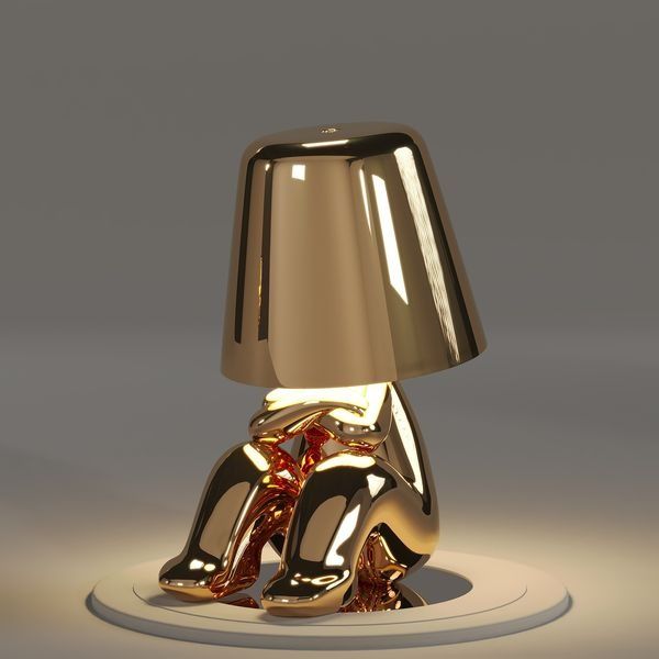 Lampe de table "Le Penseur" dorée et sans fil, lumière d'ambiance artistique rechargeable.