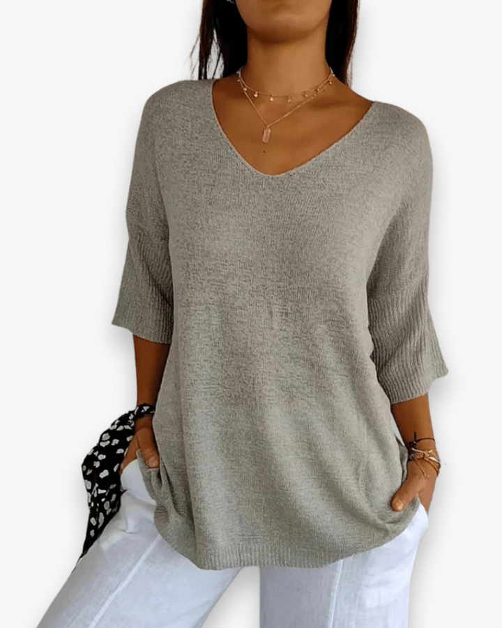 Haut chic femme, très confortable, col V et manches 3/4. Idéal pour un style décontracté et élégant.