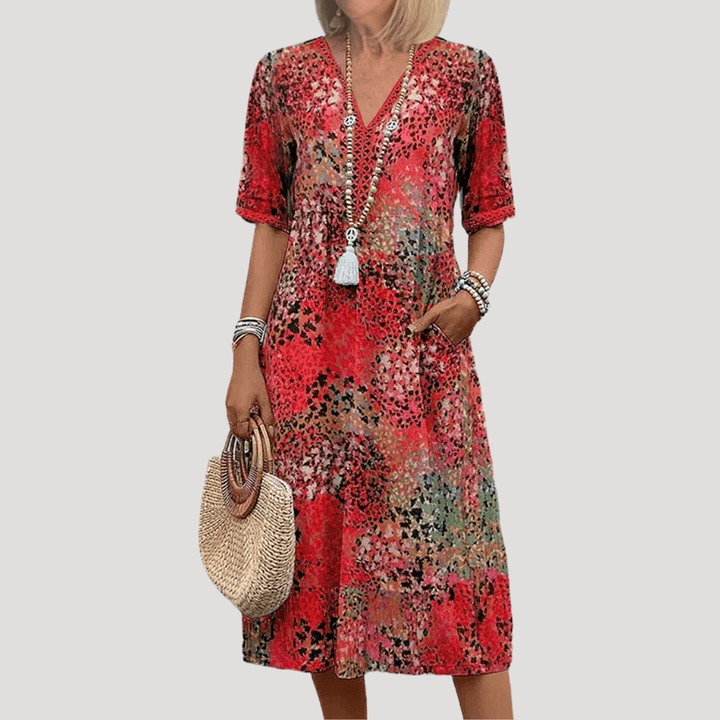 Robe midi décontractée fleurie pour femme, coupe confortable. Idéale pour un look bohème chic au quotidien, printemps/été.