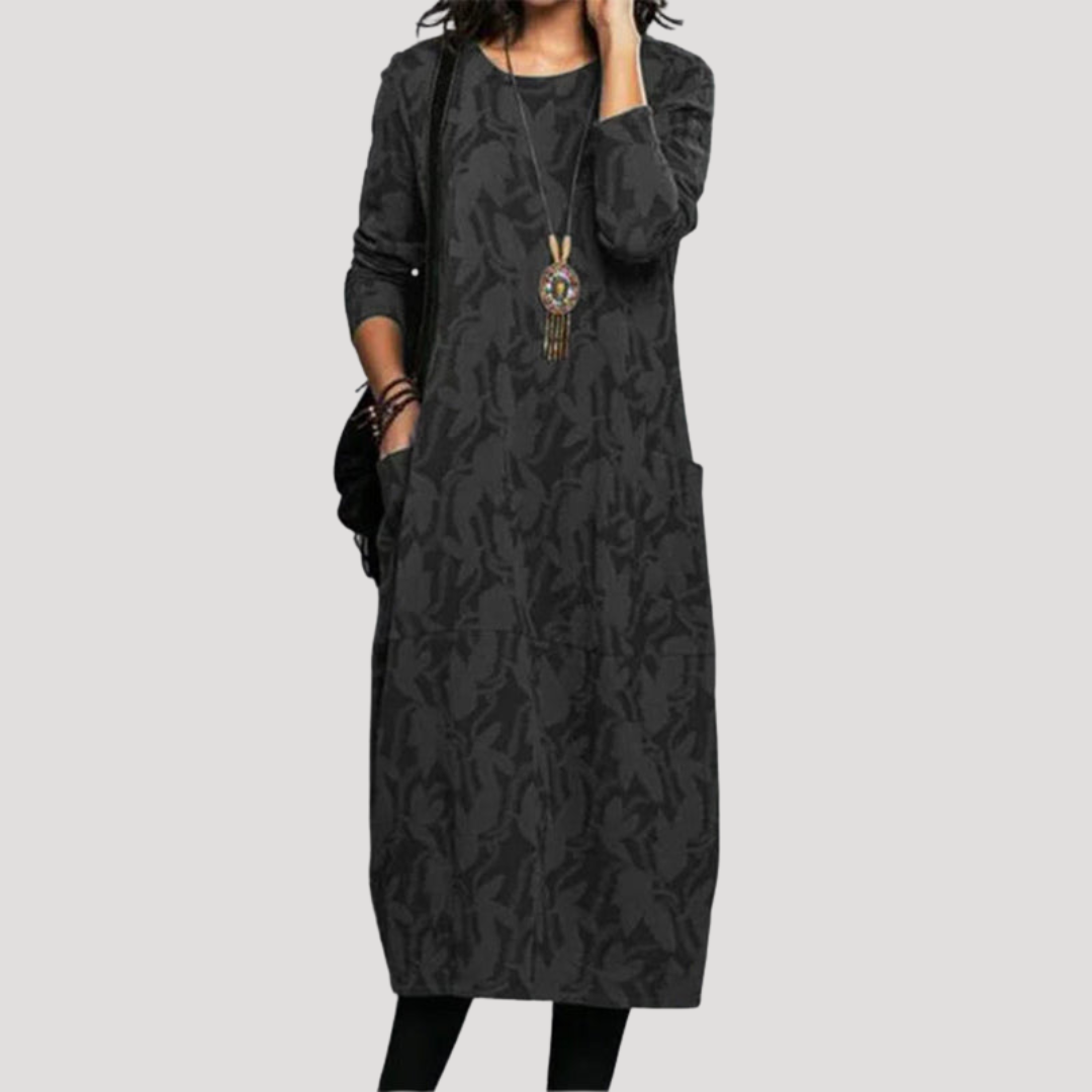 Robe midi femme à motifs originaux, manches longues. Coupe fluide et confortable, idéale pour printemps et automne.