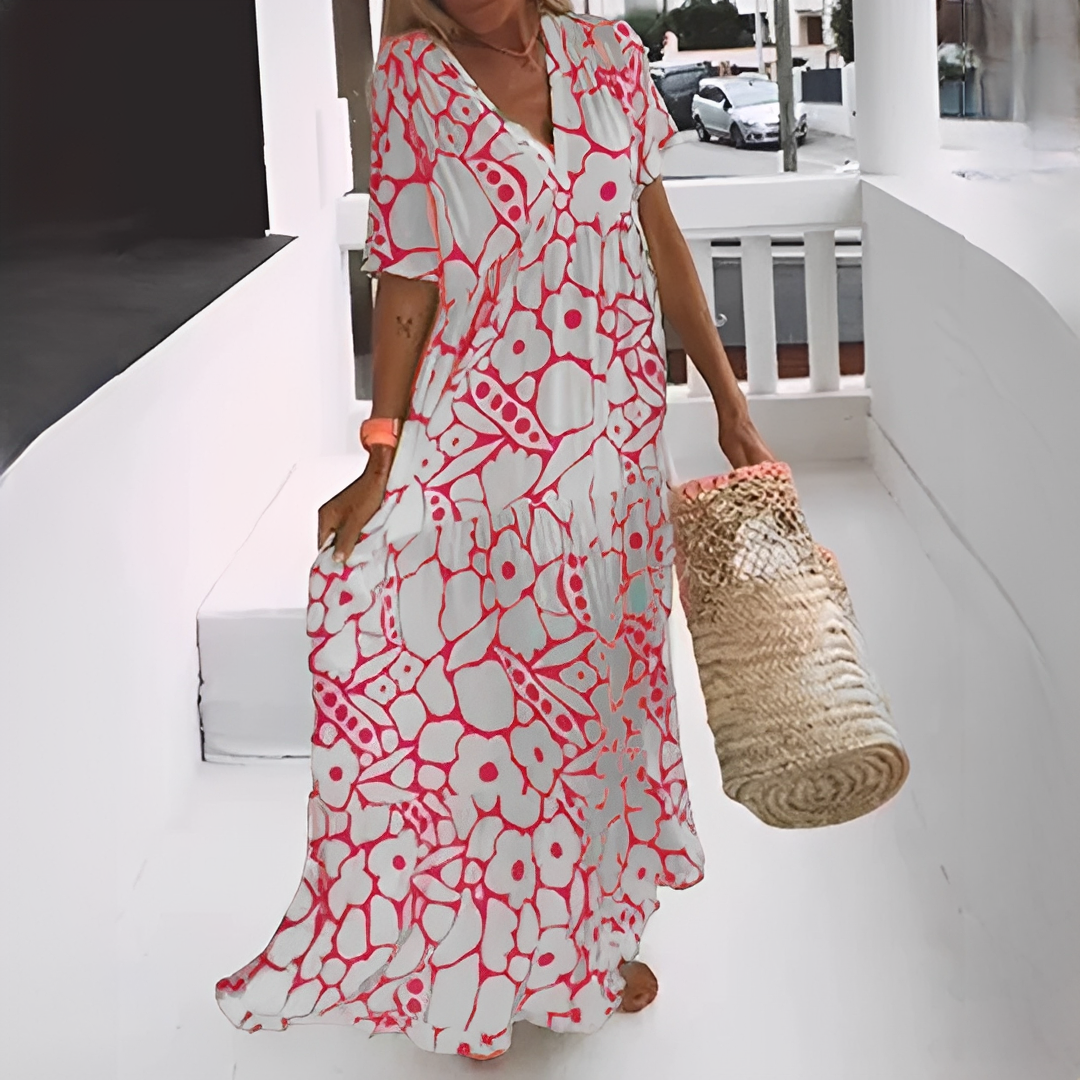 Robe fluide femme avec col V et motif tendance, idéale pour un look estival décontracté et chic.
