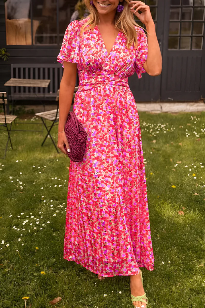 Élégante robe fleurie fluide Elisa pour femme, parfaite pour un look décontracté de printemps et d'été. Confort et style.