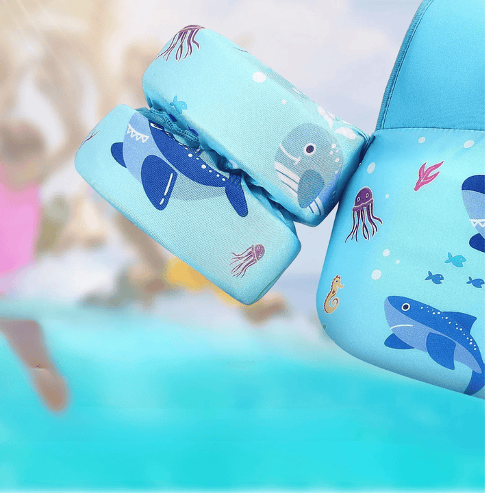 Gilet flottaison enfant avec brassards pour piscine, plage, et activités aquatiques estivales. Sécurité garantie.