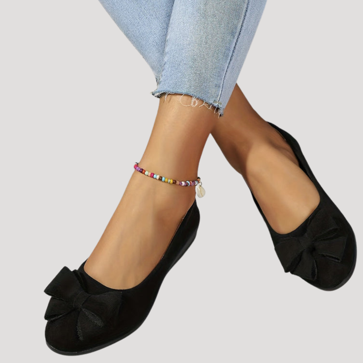 Vue de profil des ballerines compensées femme à nœud, élégance et confort pour vos pieds.