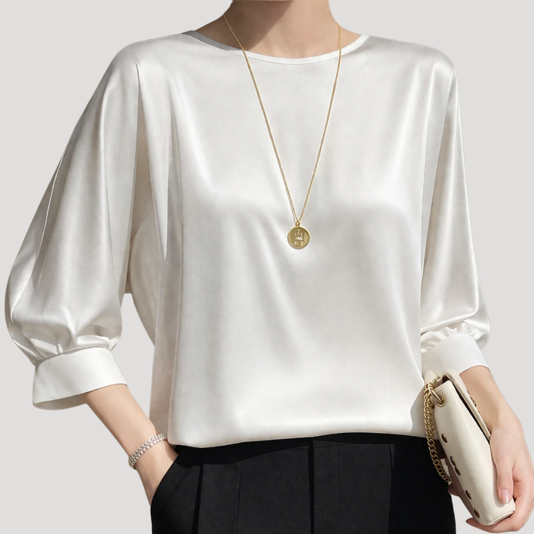 Blouse femme chic, col rond, manches 3/4. Parfaite tenue de bureau élégante ou style décontracté.
