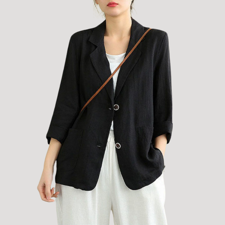 Veste femme chic boutonnée, coupe élégante, polyvalente pour costume ou mode professionnelle.