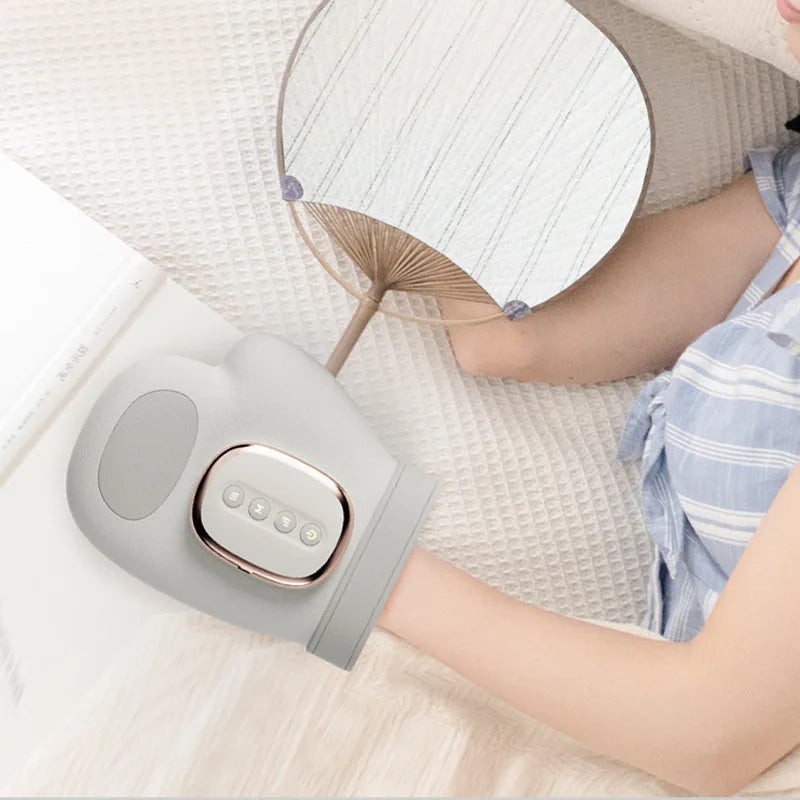 Appareil de massage des mains chauffant sans fil, avec acupression pour soulager l'arthrite et les mains fatiguées.