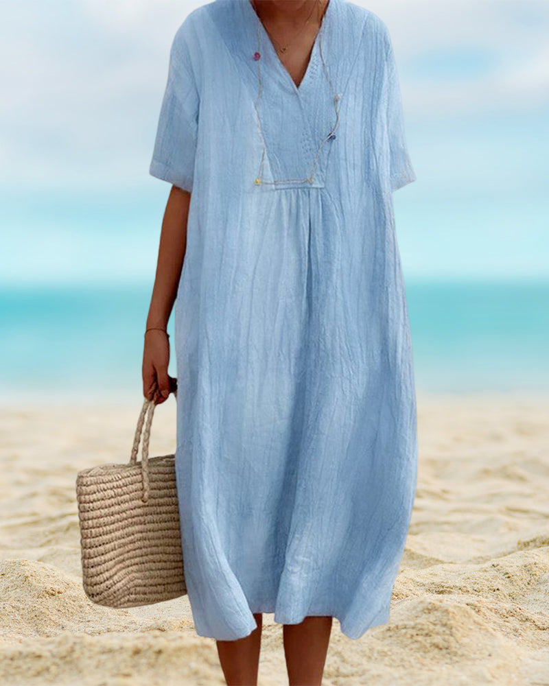 Robe d'été féminine et confortable, avec un tissu fluide et léger pour les journées chaudes.