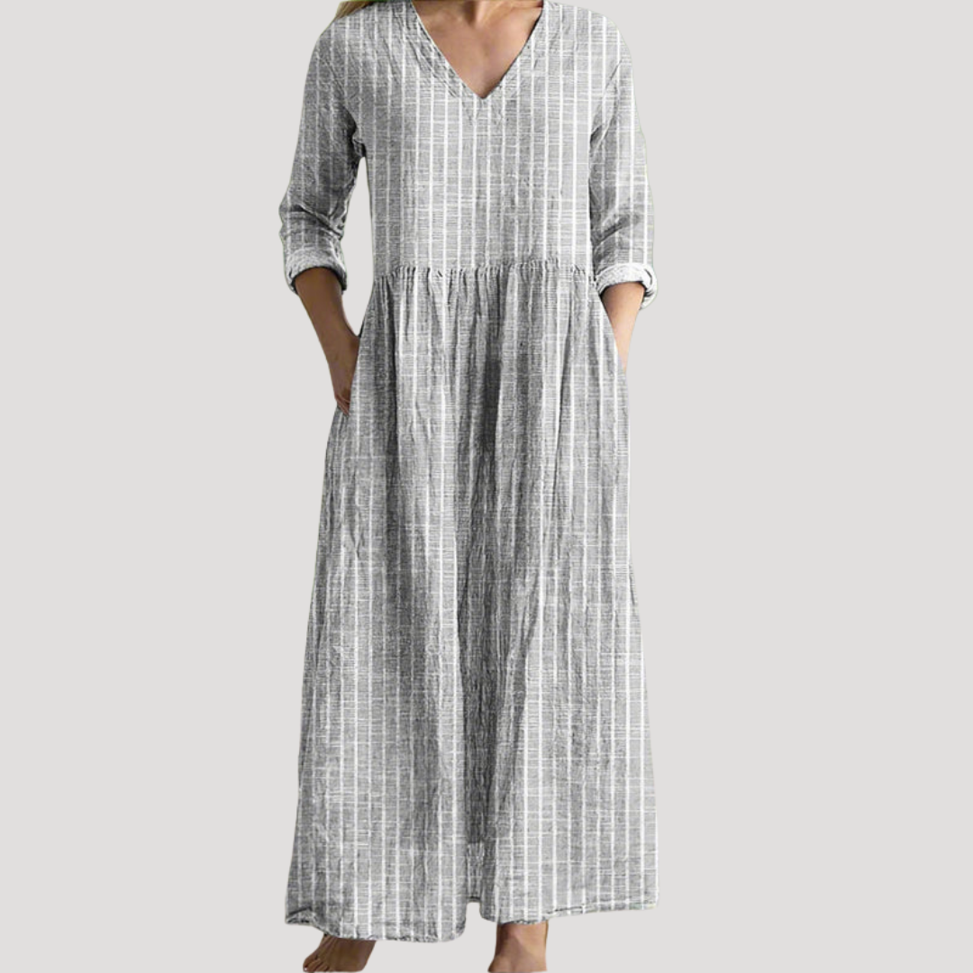 Robe femme rayée fluide, longue et confortable, avec un design élégant et des poches pratiques.