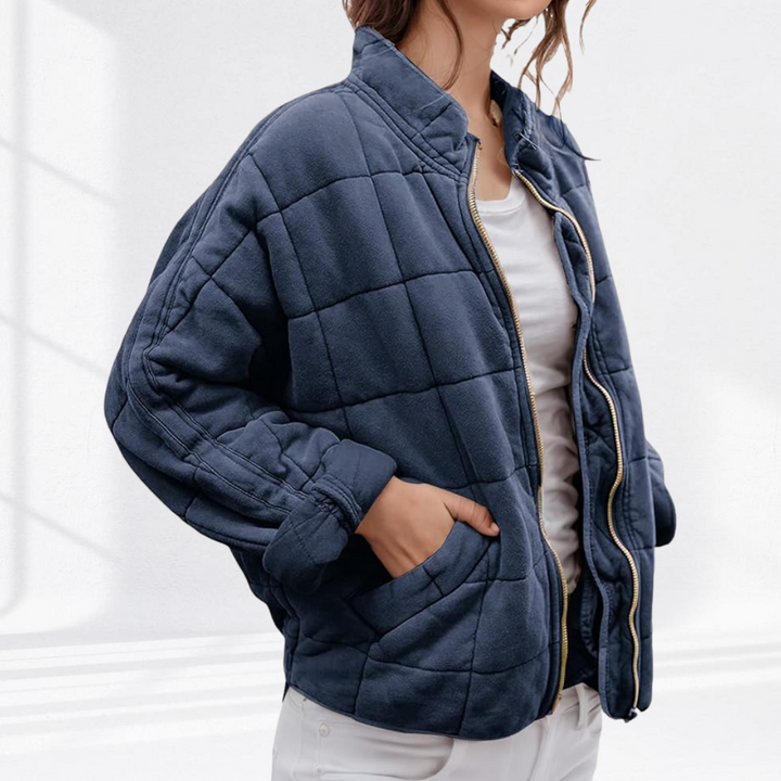 Veste matelassée femmes, design confortable, col montant, idéale pour les journées fraîches.