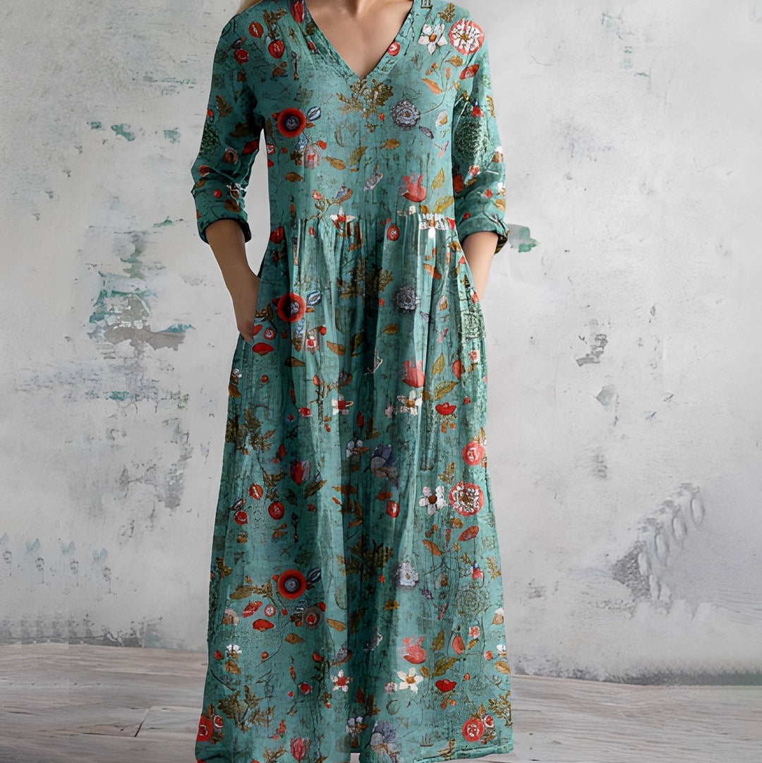 Élégante robe maxi fluide pour femme, style bohème. Col V, manches longues et poches pour un confort chic.