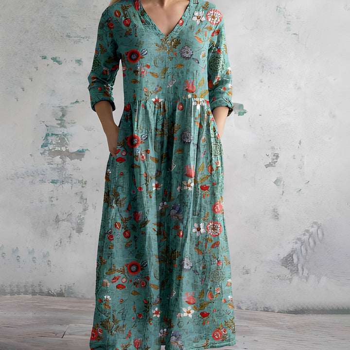 Élégante robe maxi fluide pour femme, style bohème. Col V, manches longues et poches pour un confort chic.