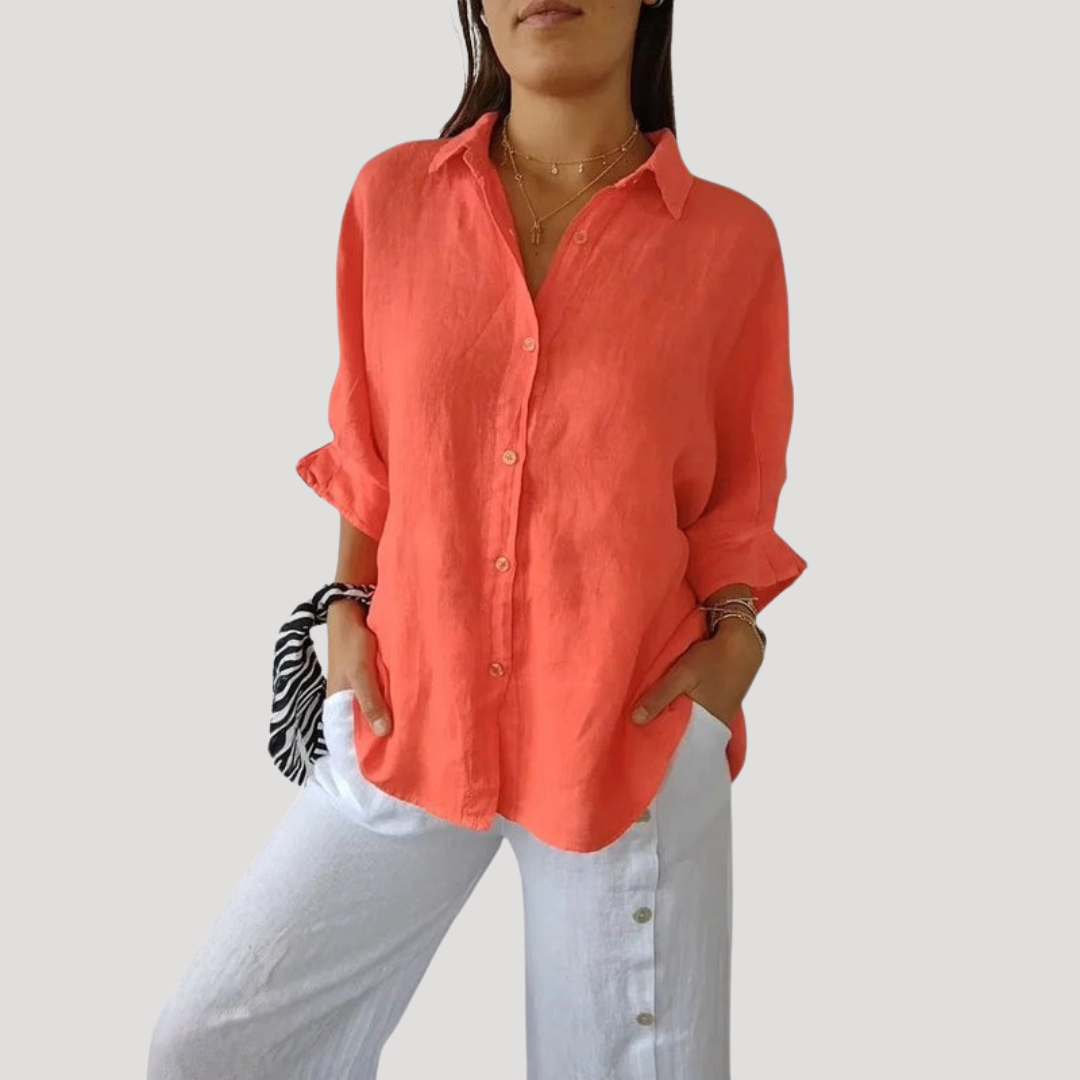 Blouse ample féminine à manches longues, tissu fluide et léger, confortable pour toutes les occasions.