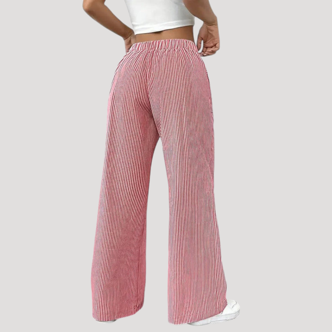 Pantalon femme décontracté à rayures colorées, jambes larges fluides. Confort et style moderne pour toutes occasions.