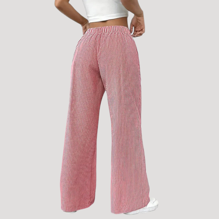Pantalon femme décontracté à rayures colorées, jambes larges fluides. Confort et style moderne pour toutes occasions.