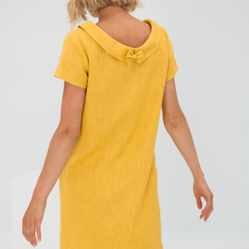 Silhouette fluide et élégante d'une robe d'été décontractée pour femme avec poches, mode estivale.
