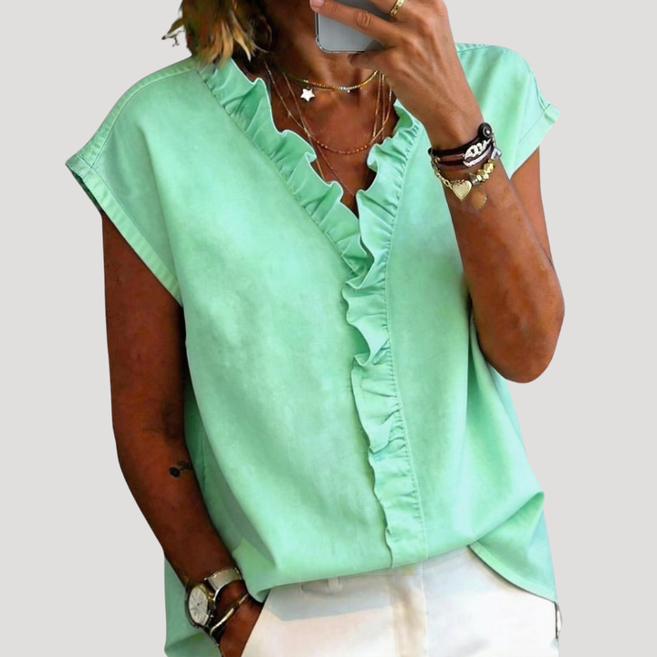 Blouse femme tendance à volants, manches courtes, style polyvalent pour un confort chic au quotidien.