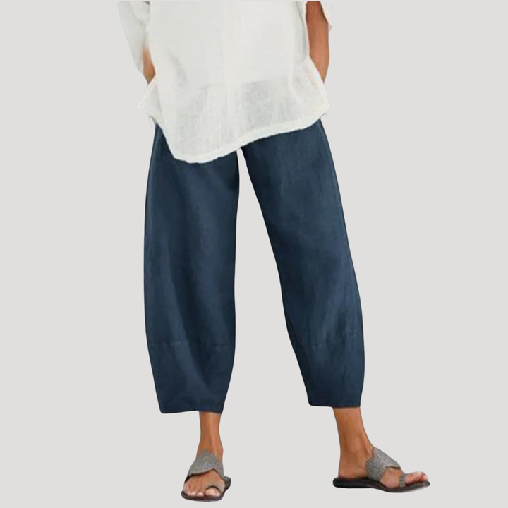 Vêtement femme: pantalon ample en lin respirant, taille élastique, pour un style décontracté et léger. Confort absolu.